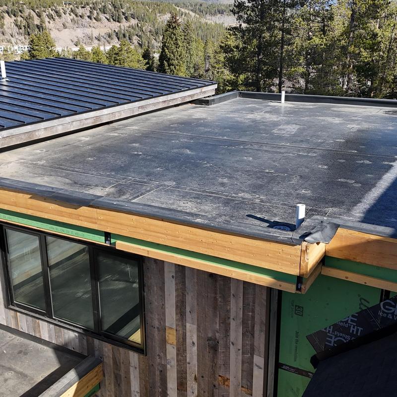 Standing seam metal roof and flat roof installation