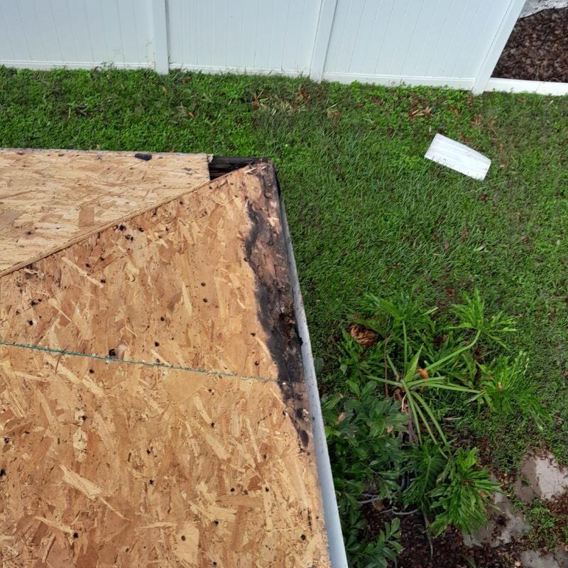 Roof decking with water damage on corner edge