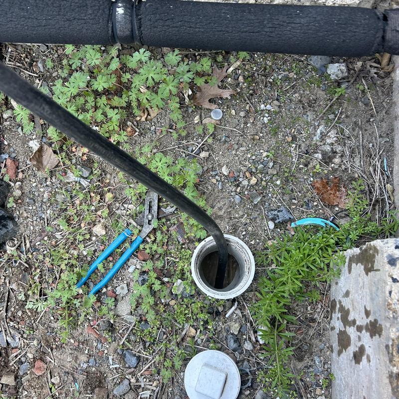 Sewer cleanout hydro jet cleaning in gravel area