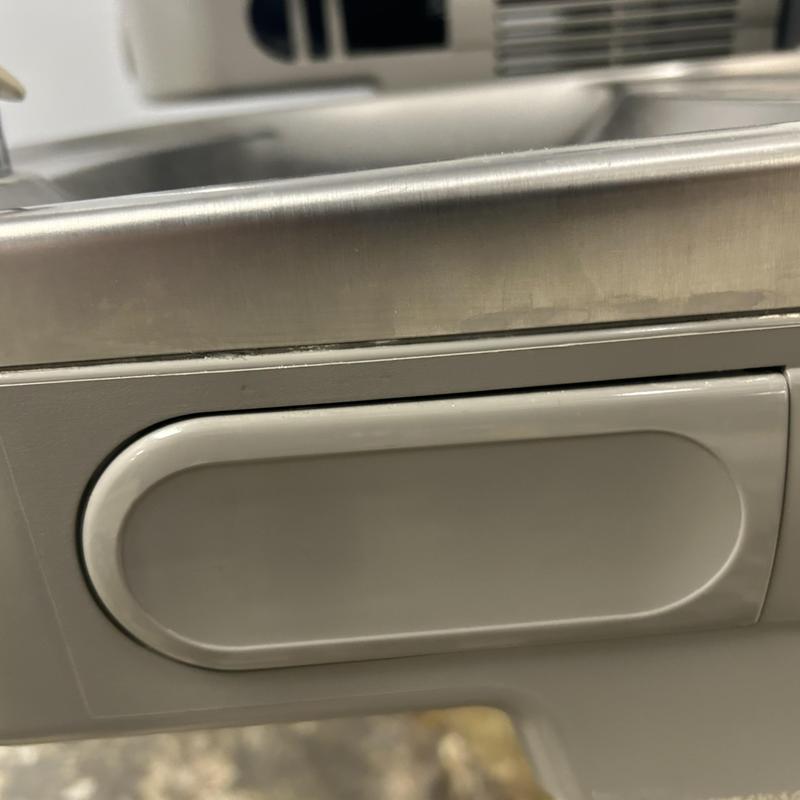 Stainless steel kitchen sink edge and trim detail