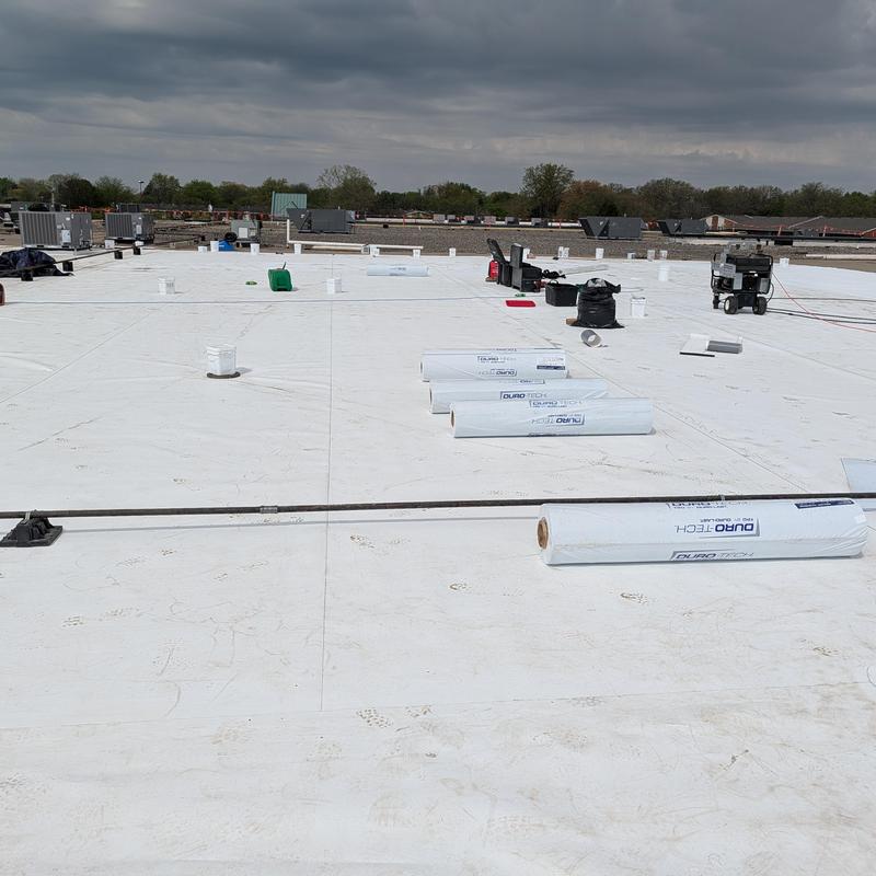 TPO single ply roofing system installation on flat commercial roof