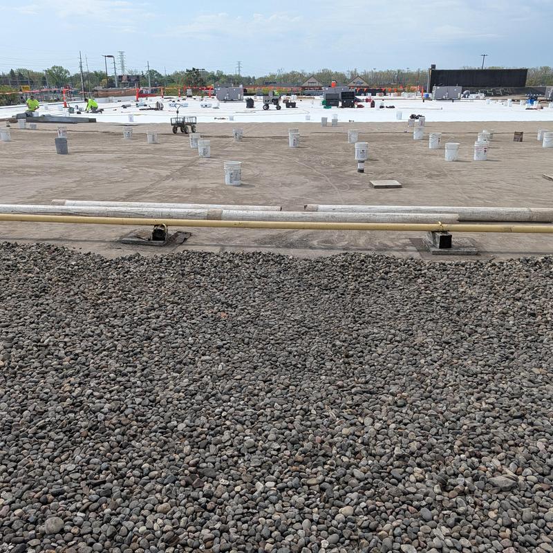 TPO single ply flat commercial roof restoration in progress
