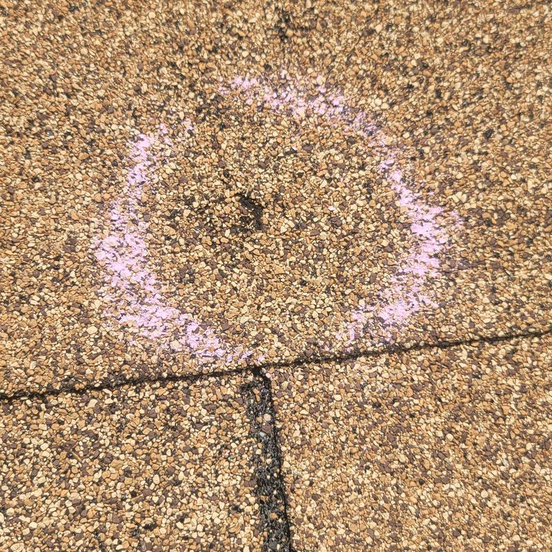 Asphalt shingle roof hail damage marked with chalk