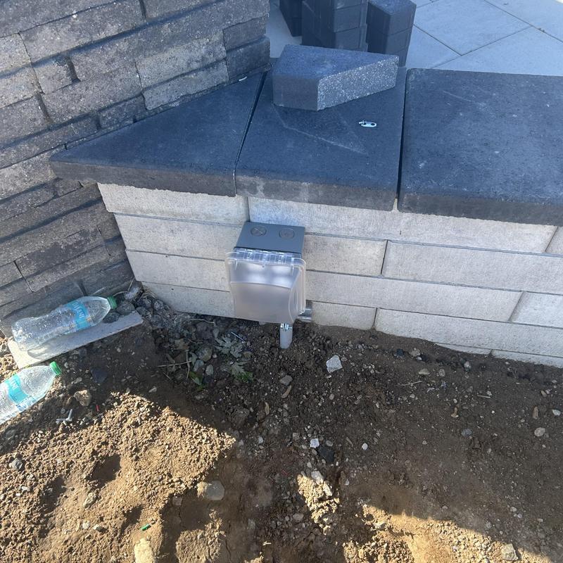 GFCI weather resistant receptacle installed on brick wall