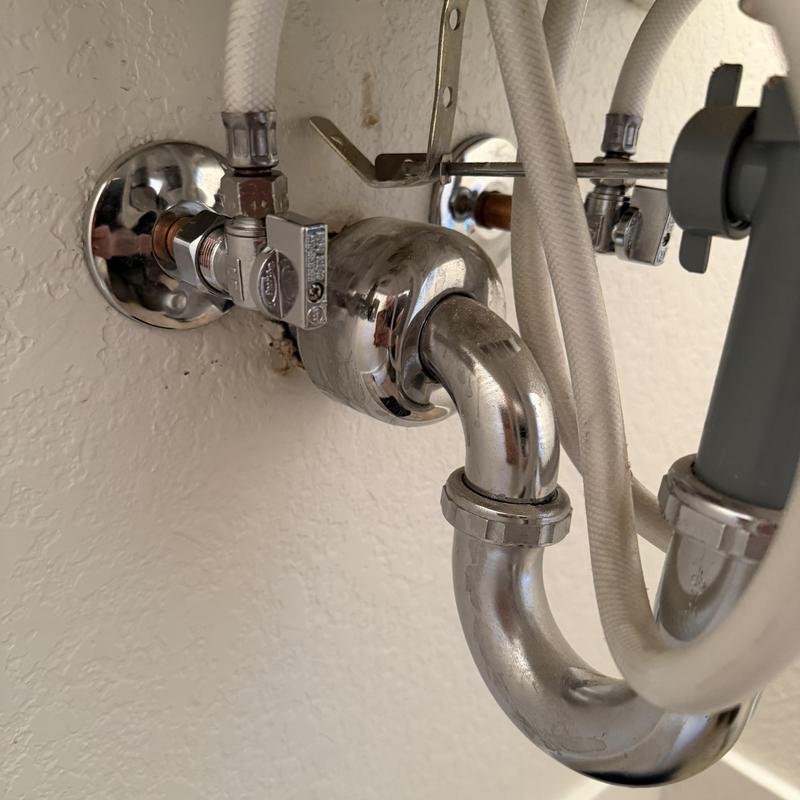 Quarter turn stop valves with supply hoses under sink