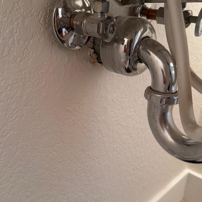 Quarter turn stop valves with chrome drain pipe under sink