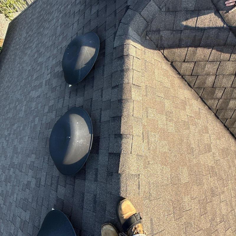 Asphalt shingle roof with hail damage and vents