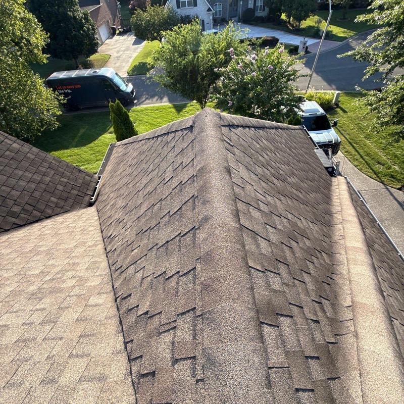 Asphalt shingle roof with hail damage and granule loss