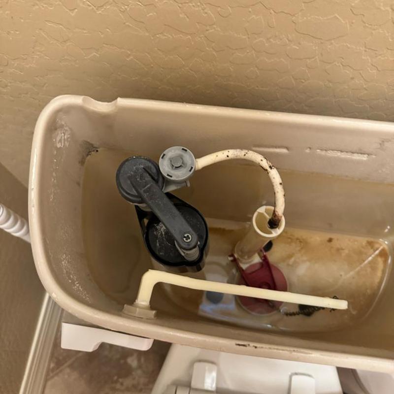 Toilet fill valve with buildup inside tank