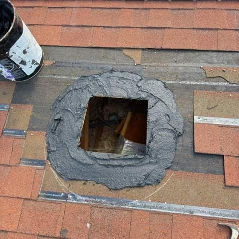 Roof flashing sealant applied around attic vent hole