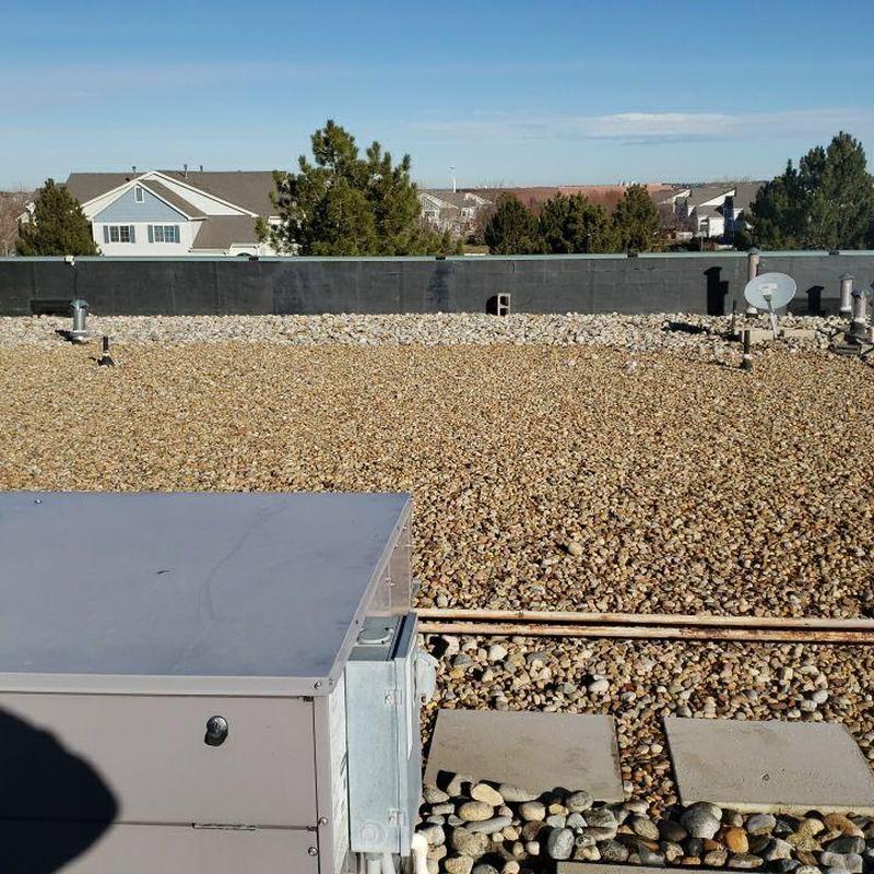 EPDM ballast roof with HVAC unit and pipe jacks