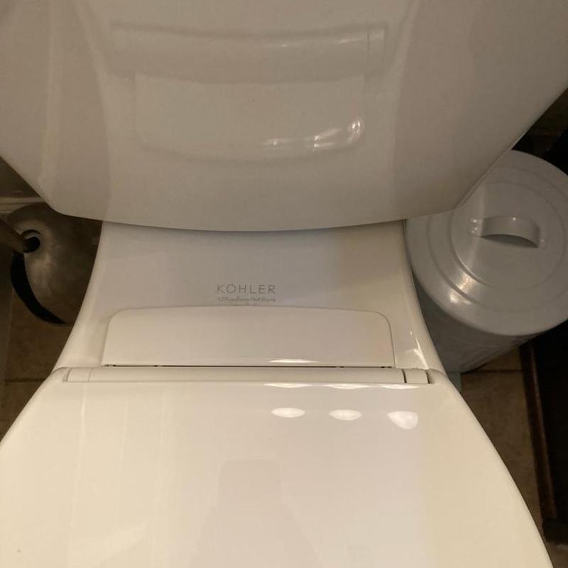 Kohler Highline white toilet installed, caulked and tested