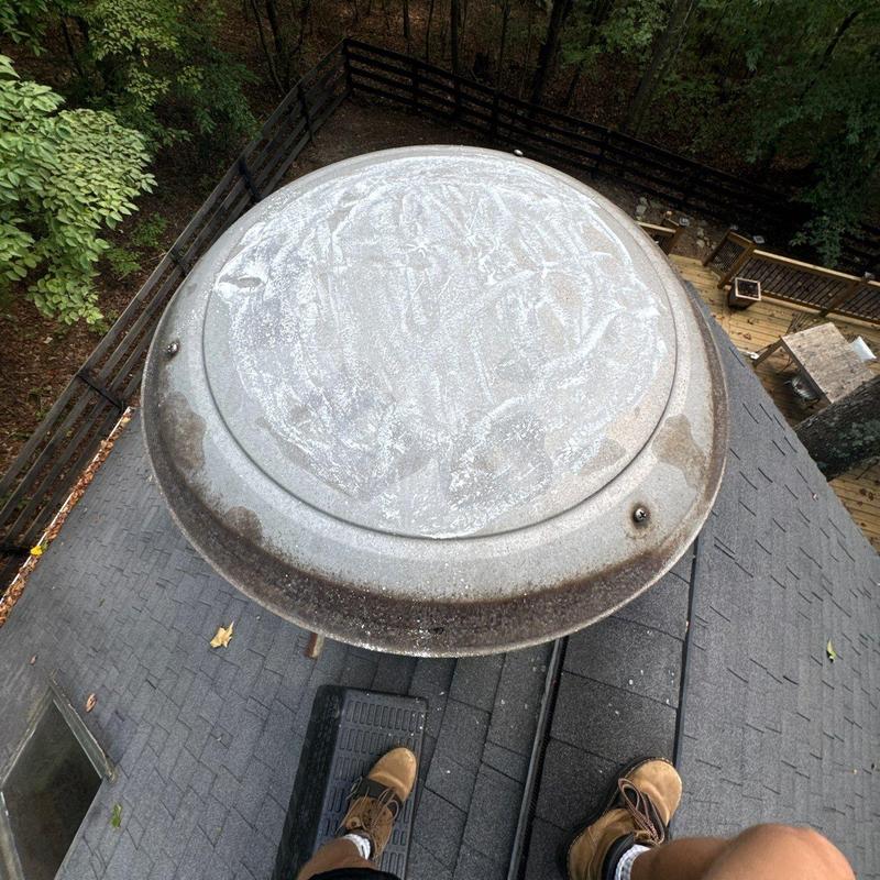 Roof vent cap with rust and wear on shingles