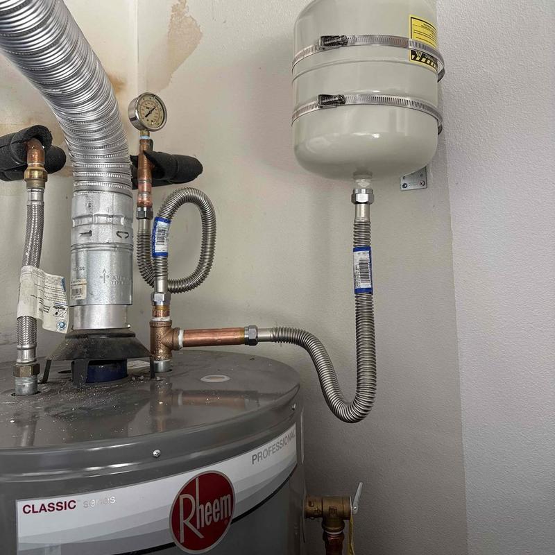Water heater with thermal expansion tank and piping