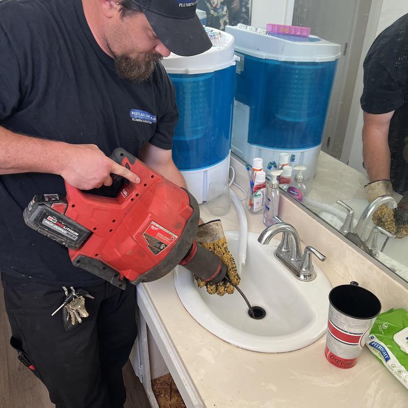 Bathroom sink drain roto rooter clearing hairball blockage Bathroom sink drain roto rooter clearing hairball blockage