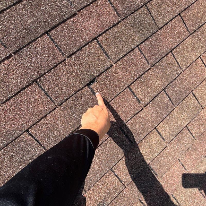 Asphalt shingles with hail damage on roof