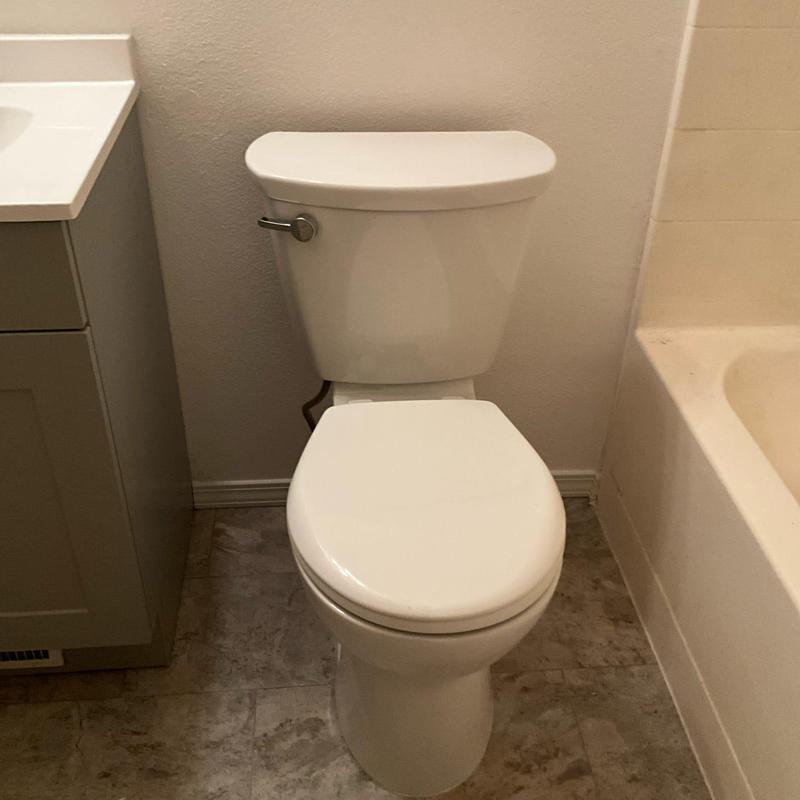 American Standard toilet installation with caulked base