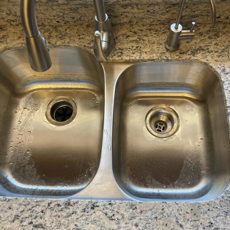 Double kitchen sink with faucets and drain installation