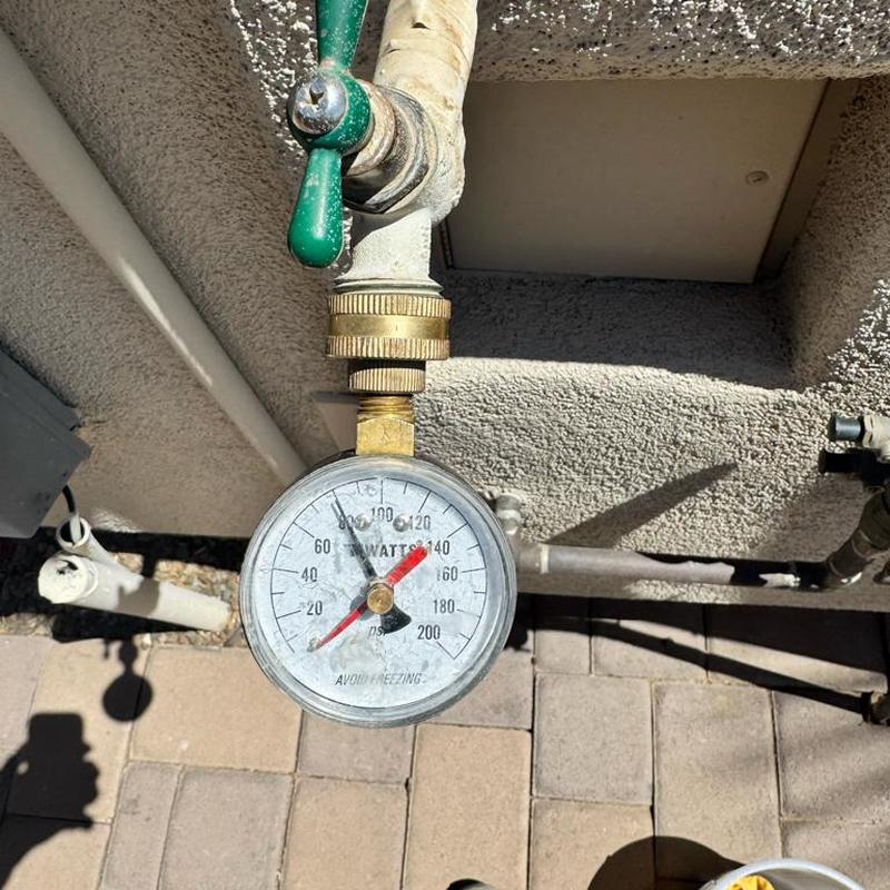 Water softener seal stack pressure gauge close-up