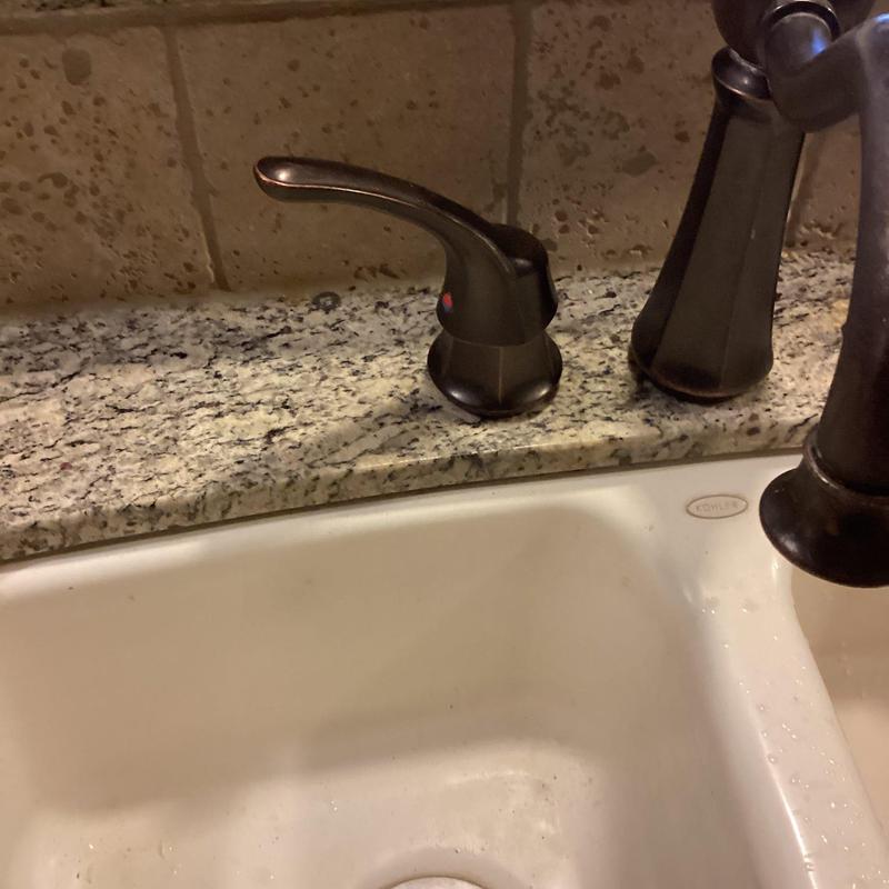 Faucet cartridge replacement on granite countertop sink
