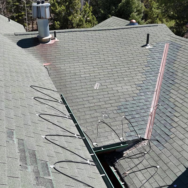 Asphalt shingle roof with heat tape installation