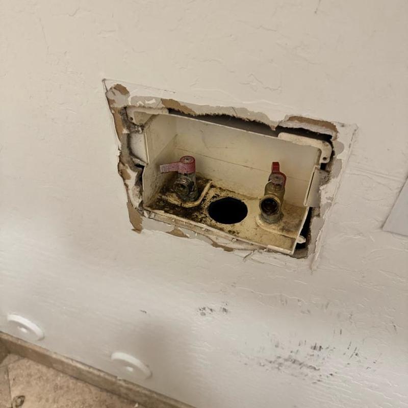 Laundry bib valve box with corroded hot and cold valves