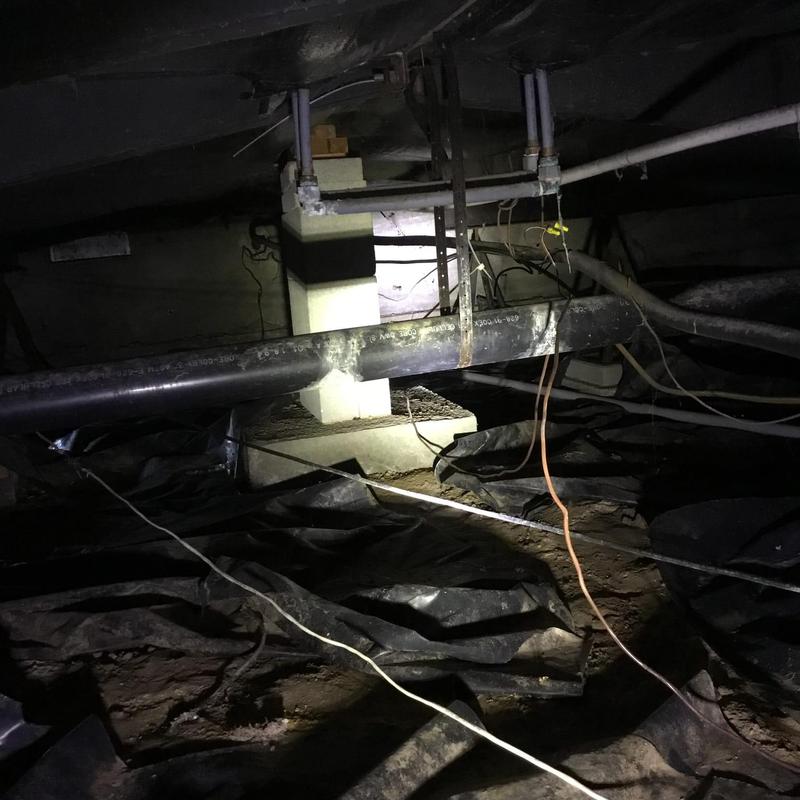 Pex piping and heater hoses in crawl space with leak