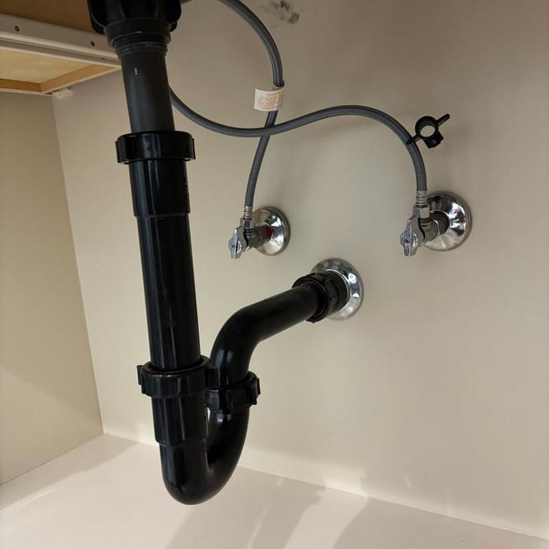 Sink drain trap and water supply valves installation under cabinet