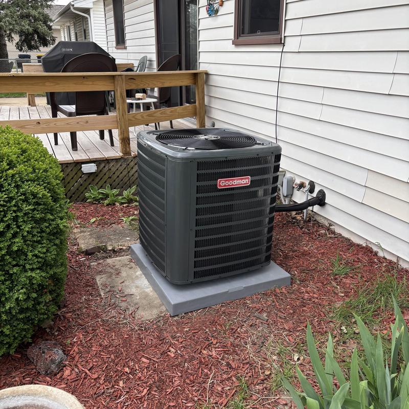 Goodman outdoor air conditioner unit on concrete pad