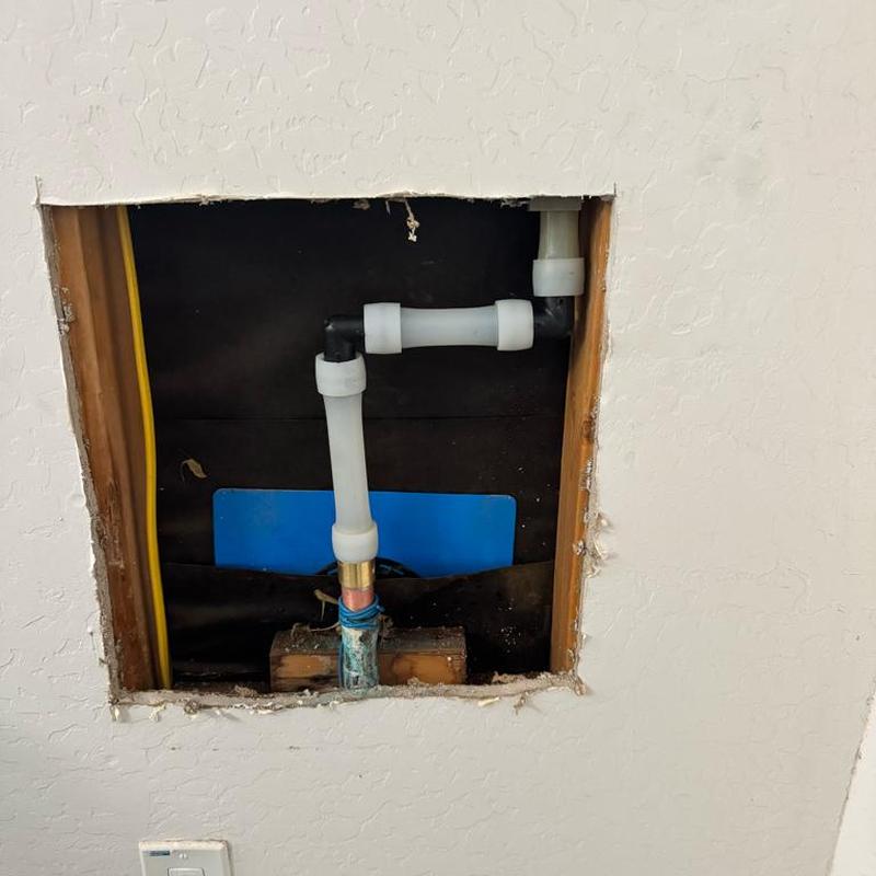 PEX water line with copper adapter and 90-degree fittings