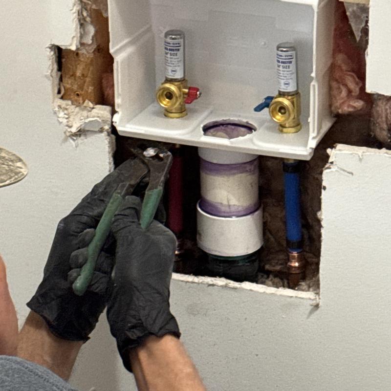 Washing machine valve box installation in wall cavity