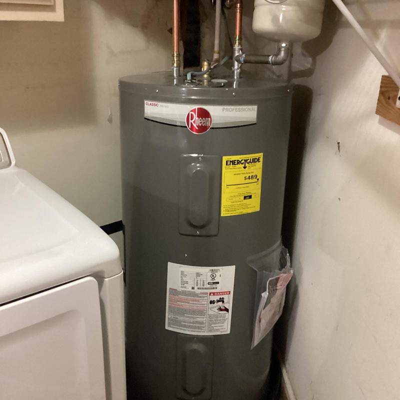 Electric water heater with expansion tank installed