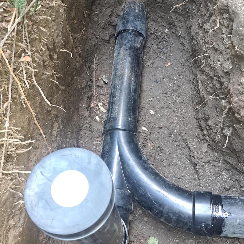 ABS drain pipe and cleanout installation in trench
