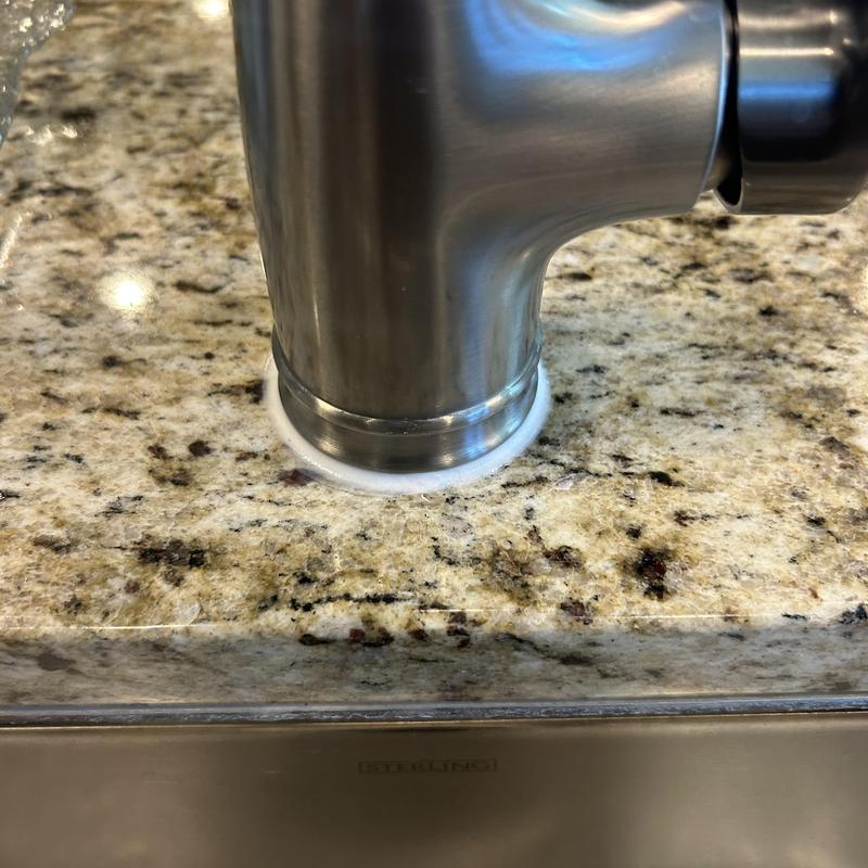 Kitchen sink faucet base waterproof seal on granite countertop