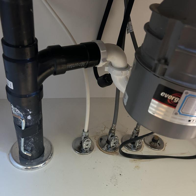 Kitchen sink drain pipes and faucet waterproofing under cabinet