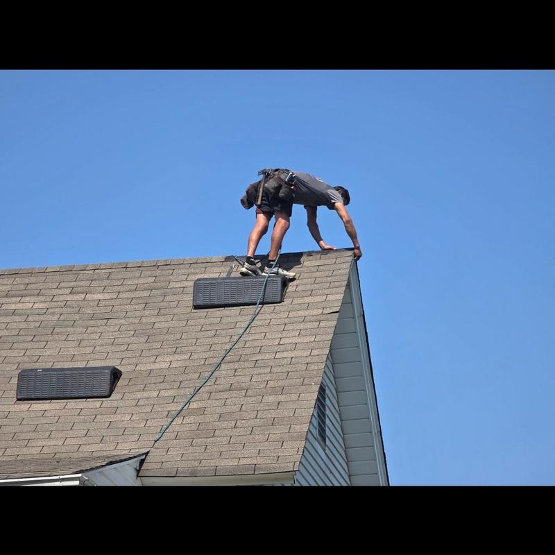 Roof ridge and drip edge metal installation on shingle roof Roof ridge and drip edge metal installation on shingle roof