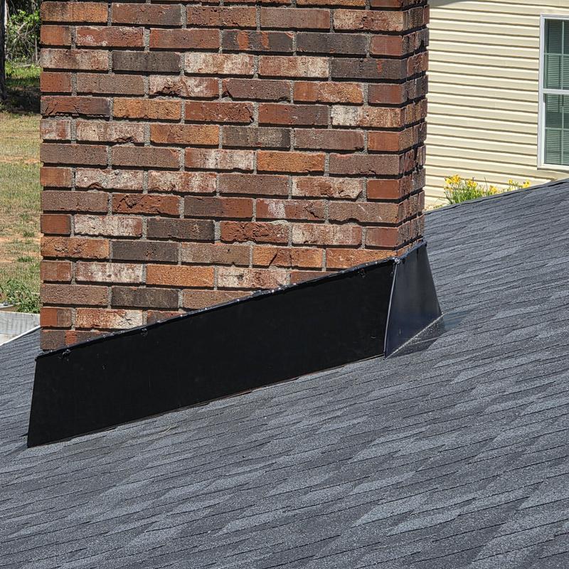 Chimney metal flashing on architectural shingle roof Chimney metal flashing on architectural shingle roof