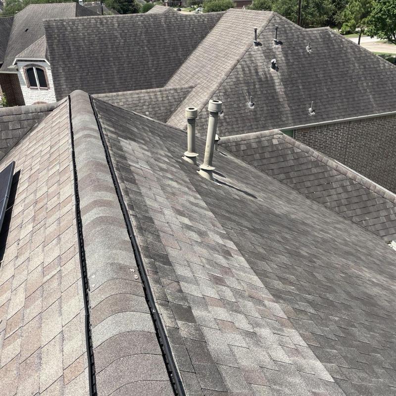 Plumbing vent flashing and shingles on residential roof Plumbing vent flashing and shingles on residential roof