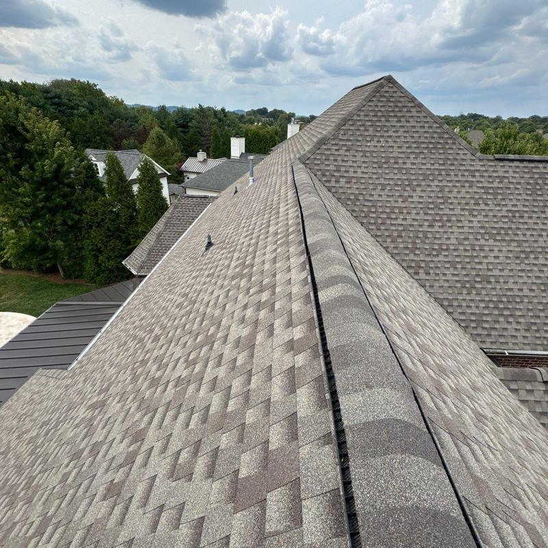 Asphalt shingles roof with ridge ventilation installation