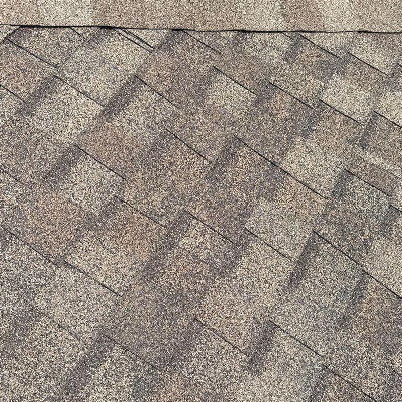 Roof shingles showing hail damage granule loss