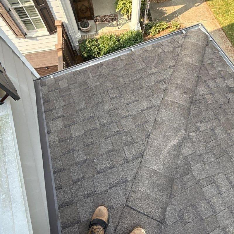 Asphalt shingle roof inspection showing hail damage