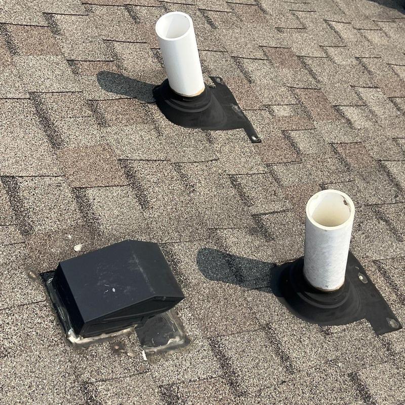 Roof pipe flashing and vent caps on asphalt shingles