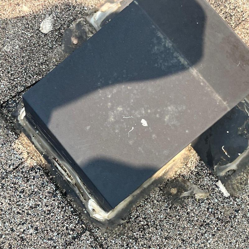 Roof vent flashing with hail damage and sealant wear