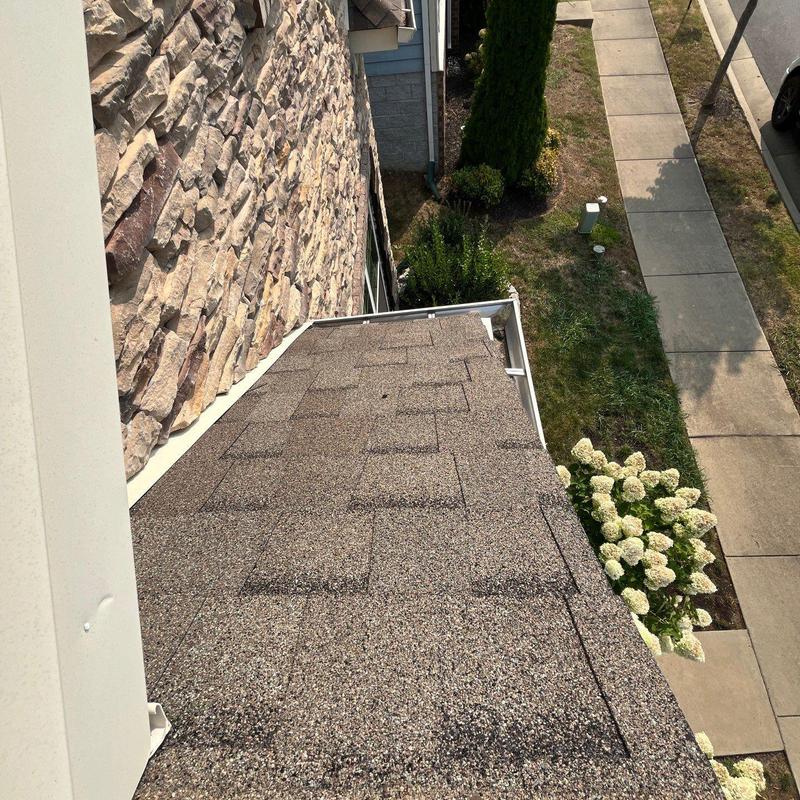 Roof shingles with hail damage and flashing inspection