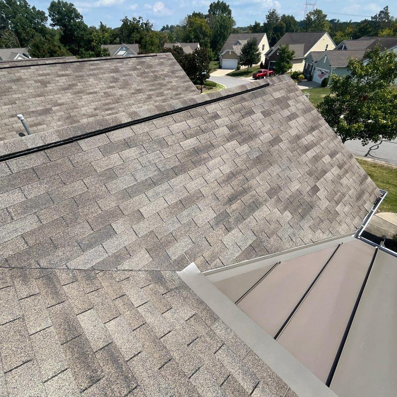 Asphalt shingle roof with hail damage inspection