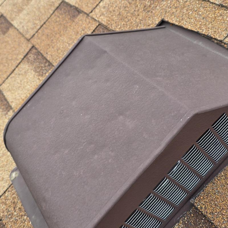 Roof vent with hail damage on asphalt shingles