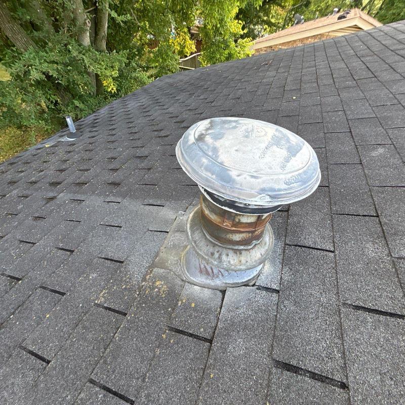 Roof vent flashing with wear on shingle roof