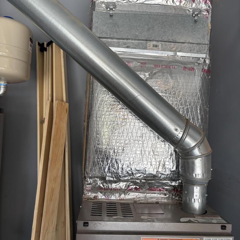 HVAC furnace with insulated ductwork and vent pipe