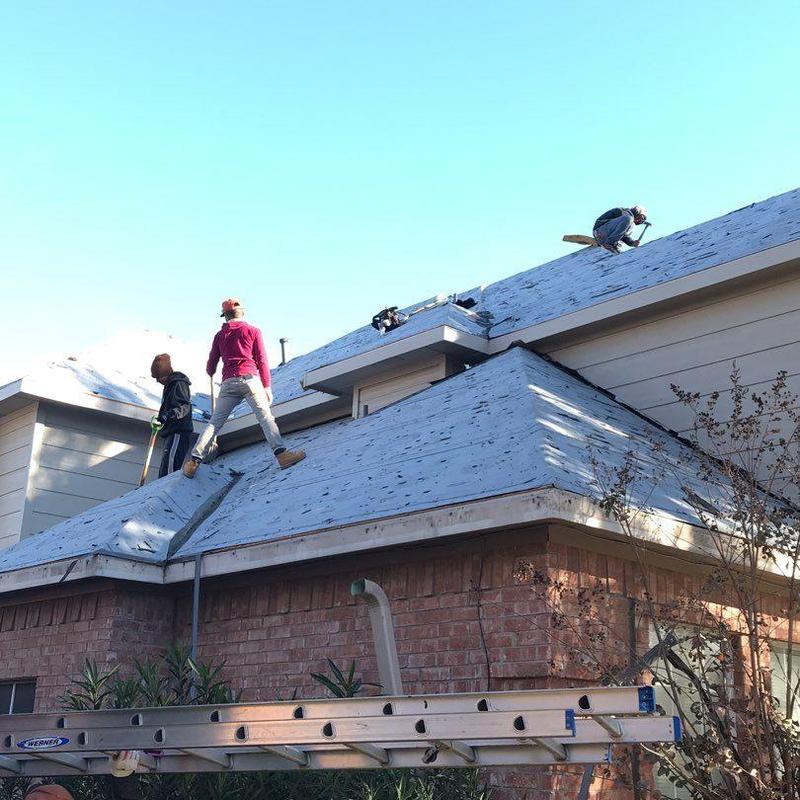 Roof deck underlayment installation on residential roof