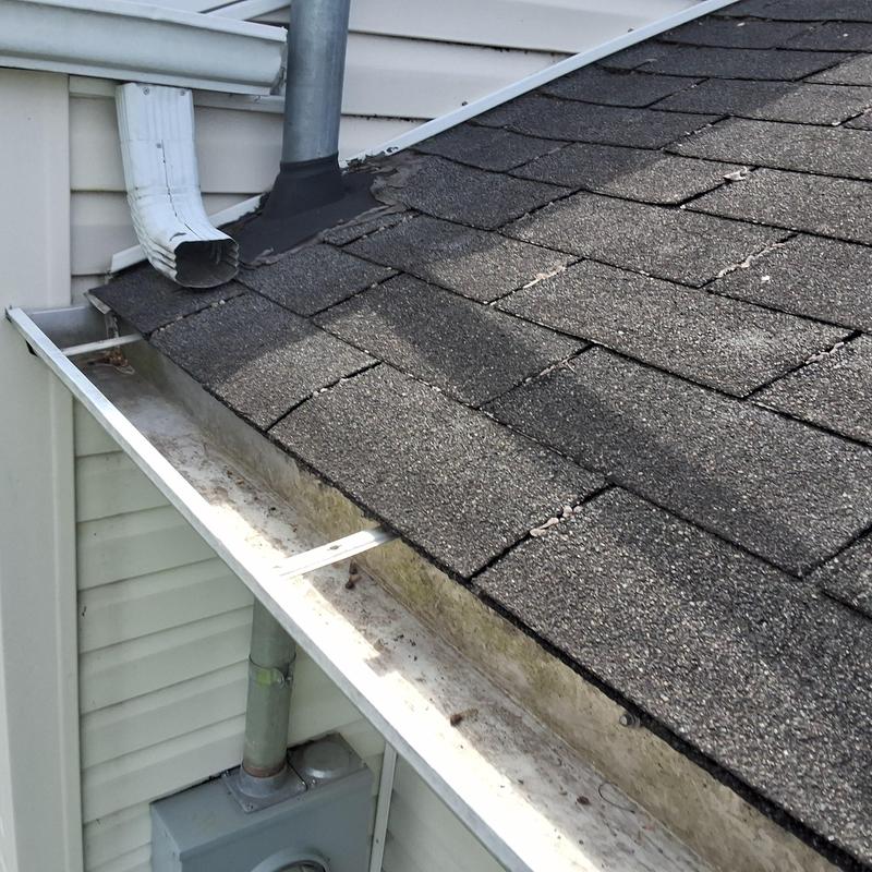 Atlas Weathered Shadow shingle roof with gutter and downspout